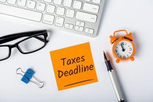 Taxes deadline or tax time - Notification of the need to file tax returns, tax form at accauntant workplace.